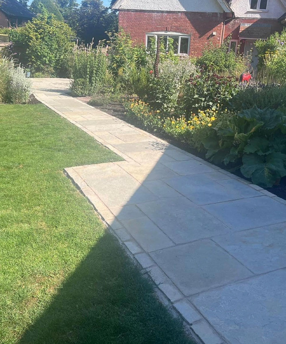 Blissford Tumbled Limestone Paving with Limestone Setts Lyndhurst