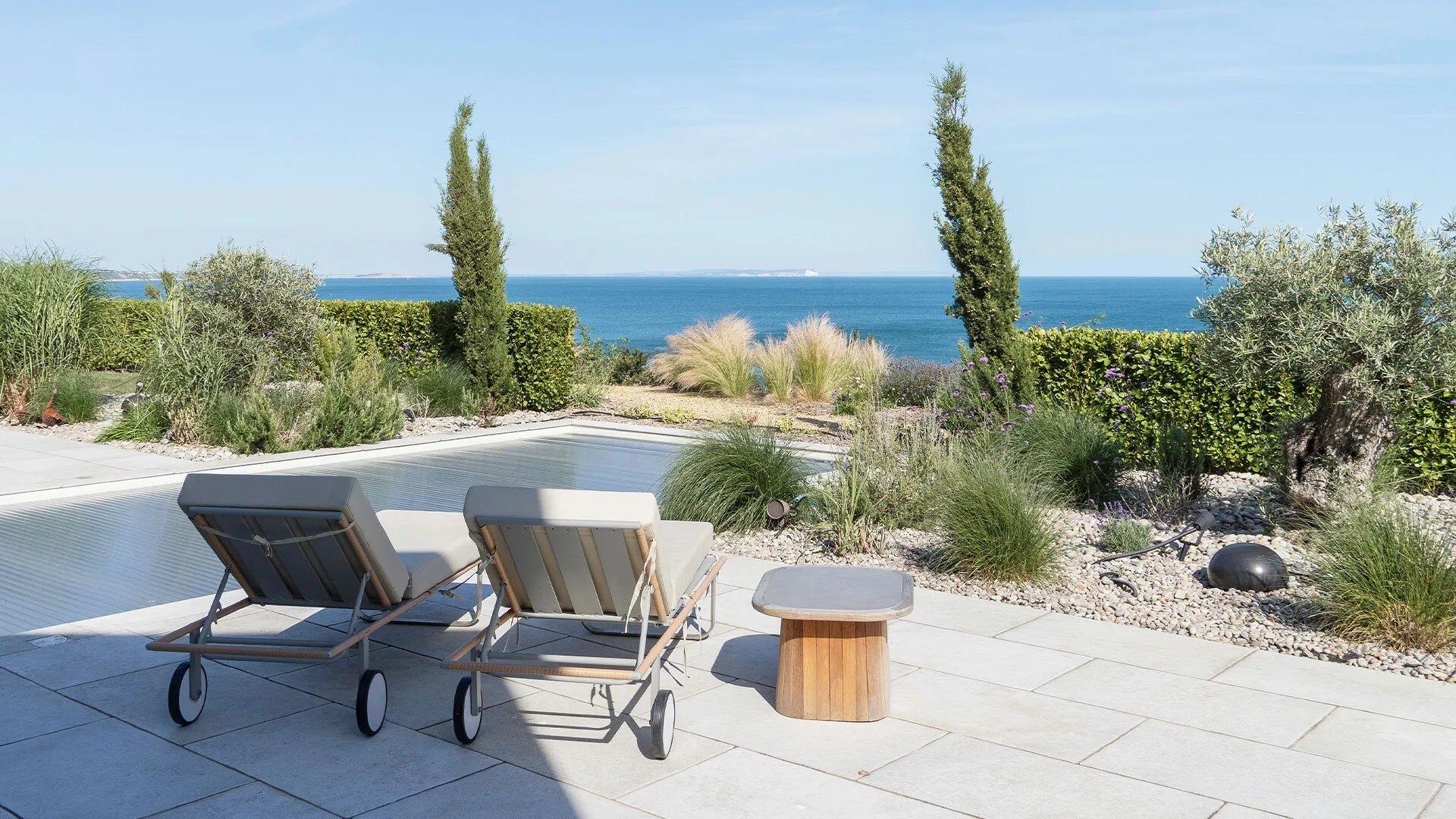 Kimmeridge Fossil porcelain pool surround paving on a Dorset coast pool build